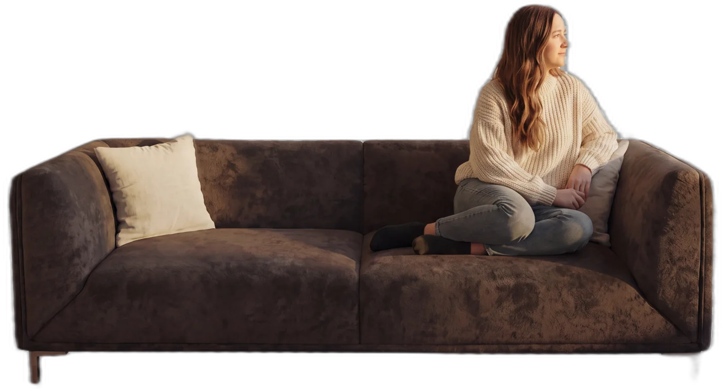 A Citifurniture velvet sofa with a woman seated on it, presented on a showroom floor — furniture marketing agency Lebanon