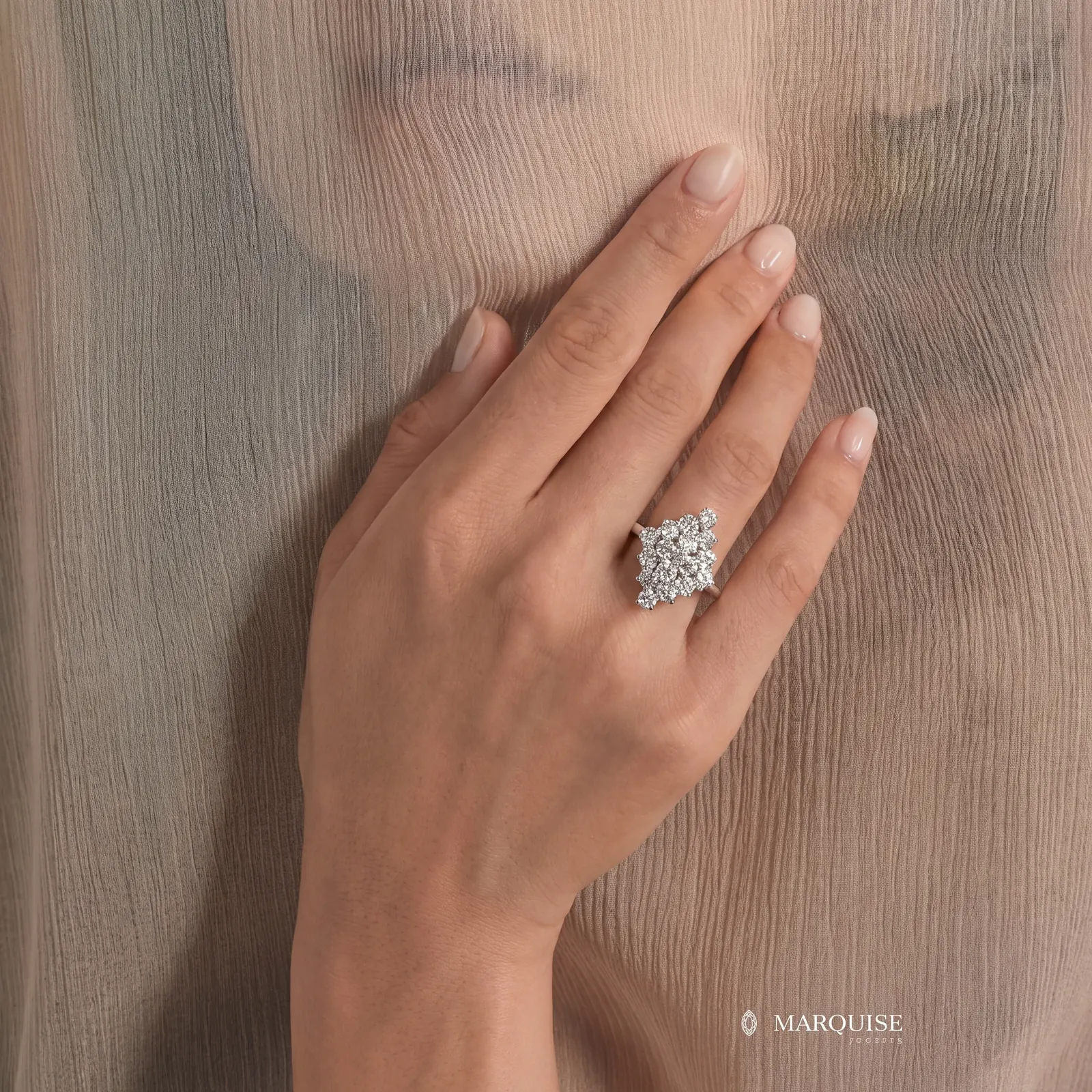 AI jewelry photography: diamond cluster ring on hand behind sheer fabric
